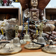 Load image into Gallery viewer, collection of Tibetan Tingsha Bells, Symbols , beads and a large statue.
