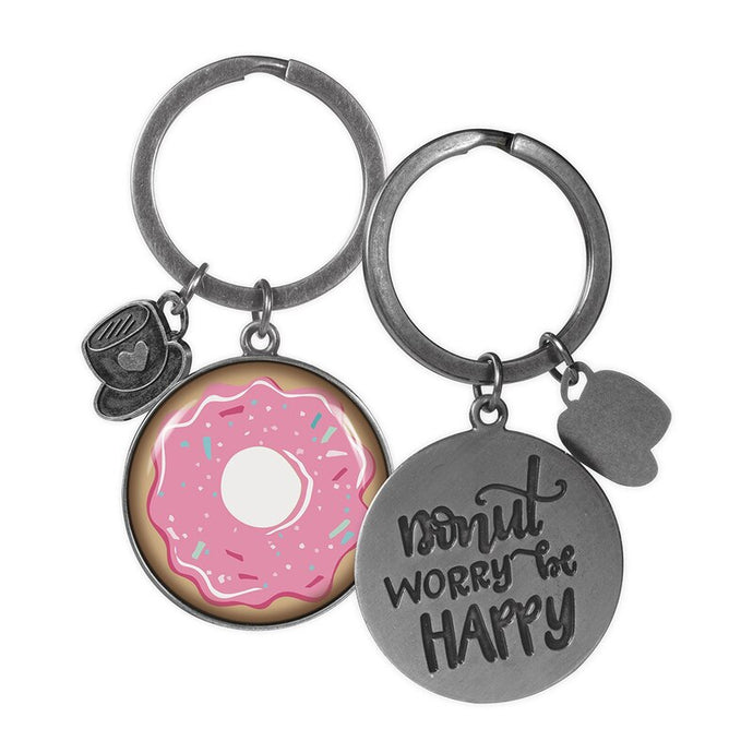 two key rings a pink donut on one and donut worry be happy on the other