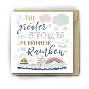 white greetings card with message the greater the storm the brighter the reainbow